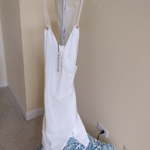 Cute handkerchief mini dress with rope accents..